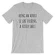 Load image into Gallery viewer, BEING AN ADULT IS LIKE FOLDING A FITTED SHEET Unisex Tee (6 colors) - The Sweetest Tee